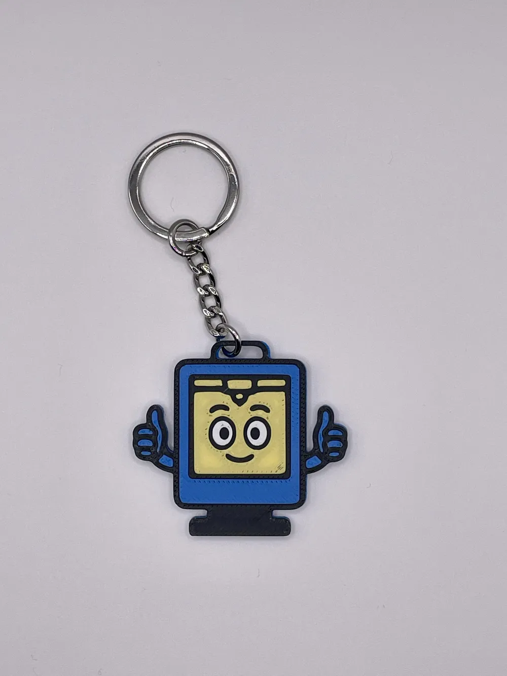 Printer buddy keychain on a metal key ring