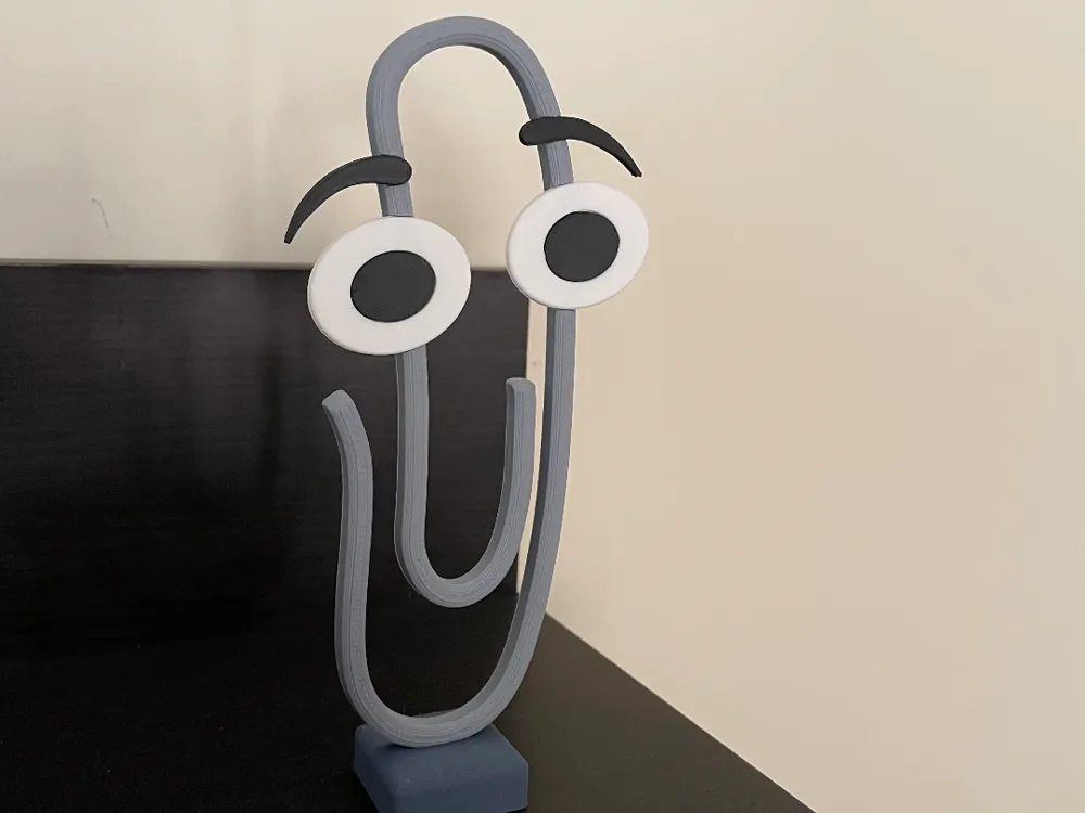 3D-printed Clippy paperclip desk buddy with large cartoon eyes