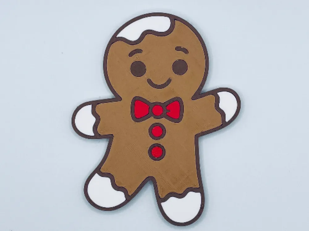 Gingerbread man fridge magnet with red bow tie