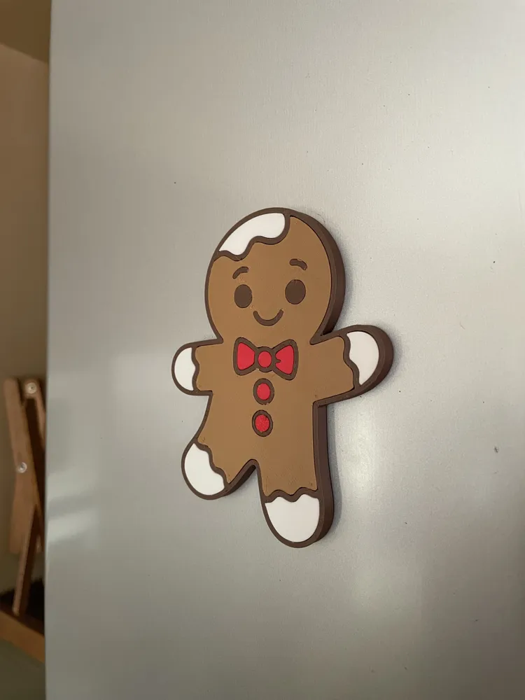 Gingerbread man fridge magnet on a refrigerator door