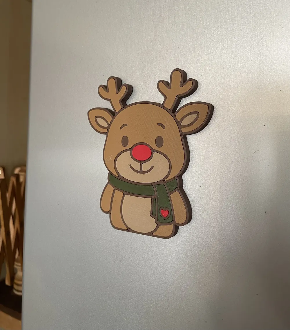 Reindeer fridge magnet on a refrigerator door