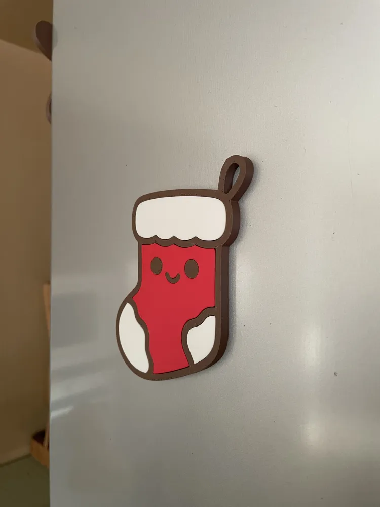 Stocking fridge magnet on a refrigerator door