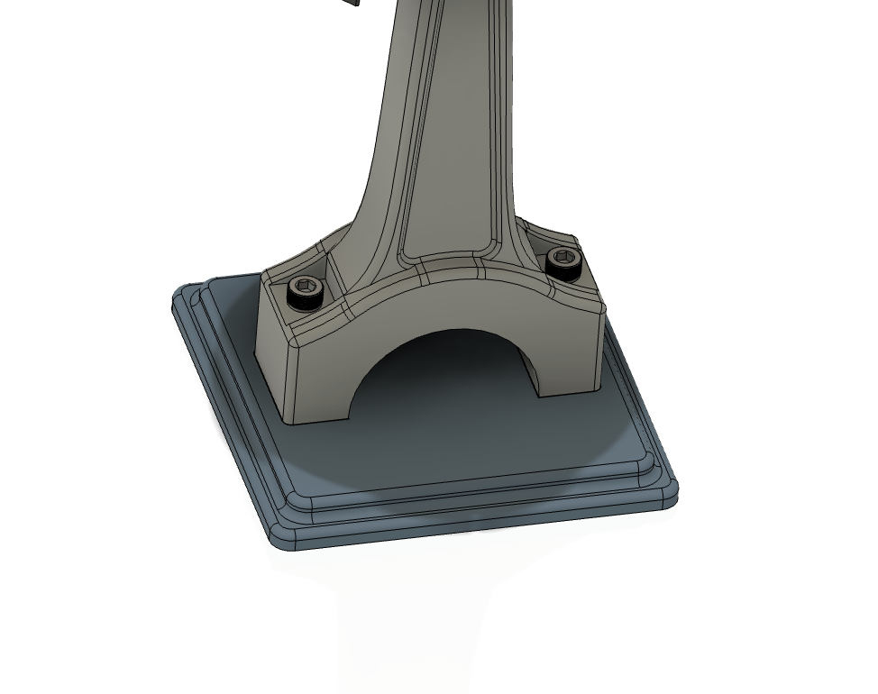 Stepped base with central rod support, secured by two socket-head screws