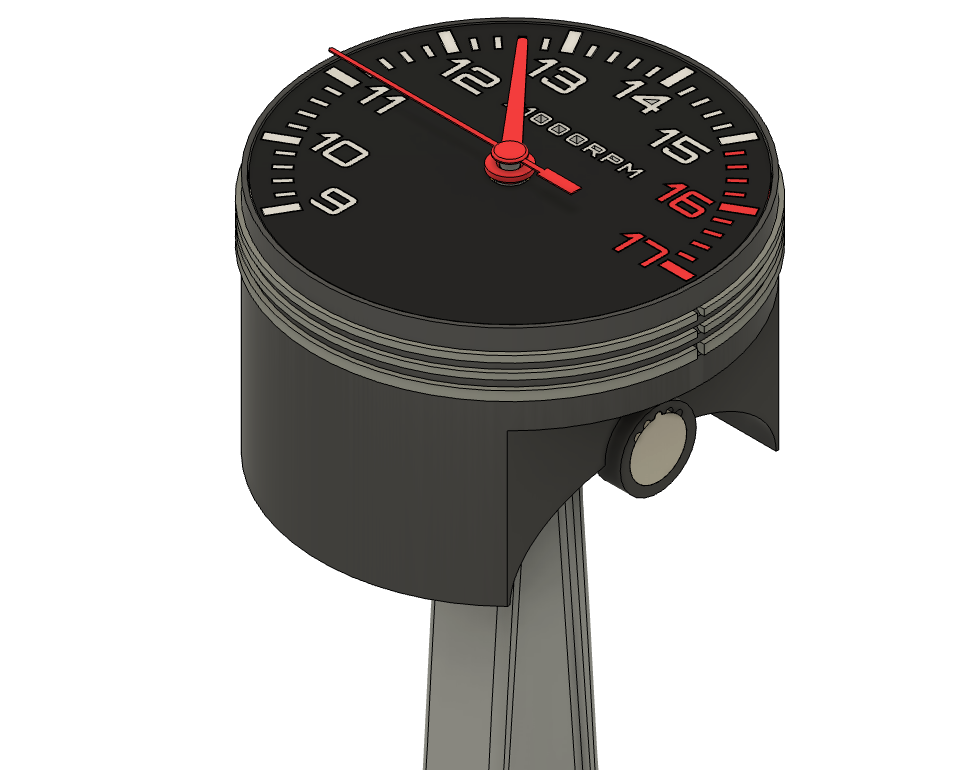 Piston clock angled view with crown on side, dial 9-17 and red zone, rod below