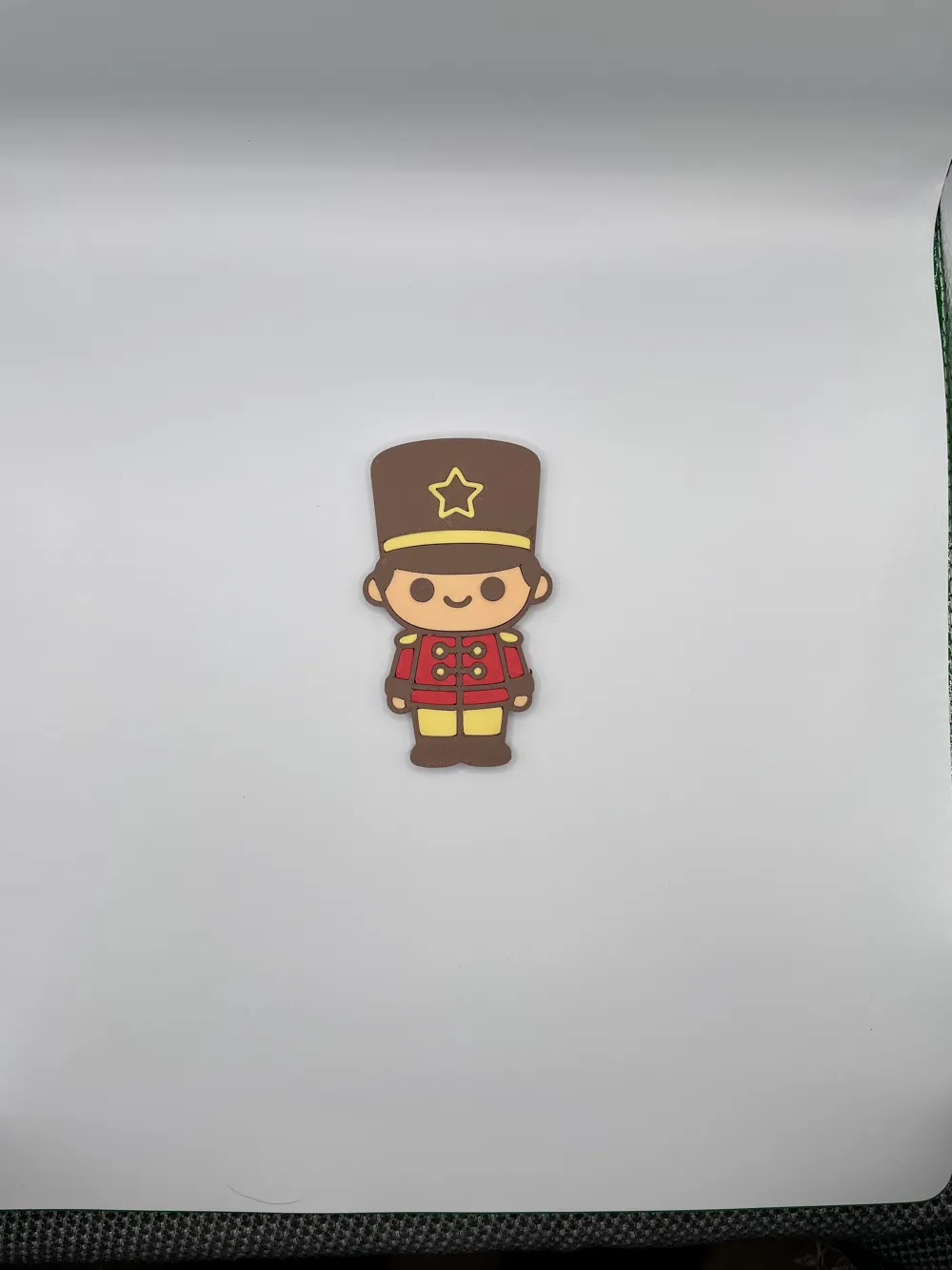 Toy soldier fridge magnet on a refrigerator door